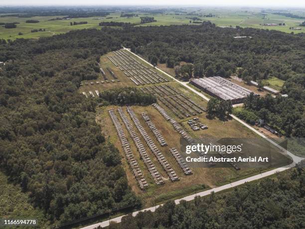high angle view of multiple tanks surrounded by a forest, italy - military vehicles and engineering establishment stock pictures, royalty-free photos & images
