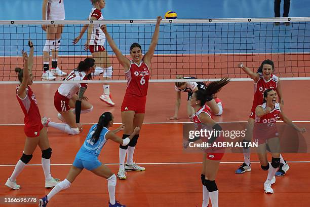 Turkey's players celebrate after winning point during the 2019 Women's European Volleyball Championship semi-final match between Turkey and Poland in...
