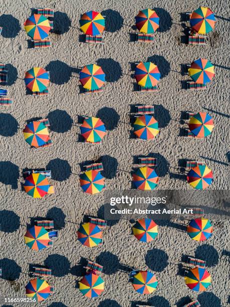 Colourful beach umbrellas shot from above, Veneto, Italy