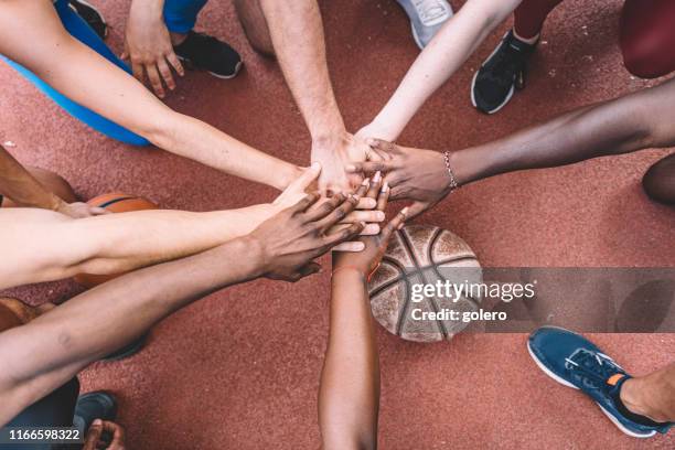 all for one - sports team huddle stock pictures, royalty-free photos & images