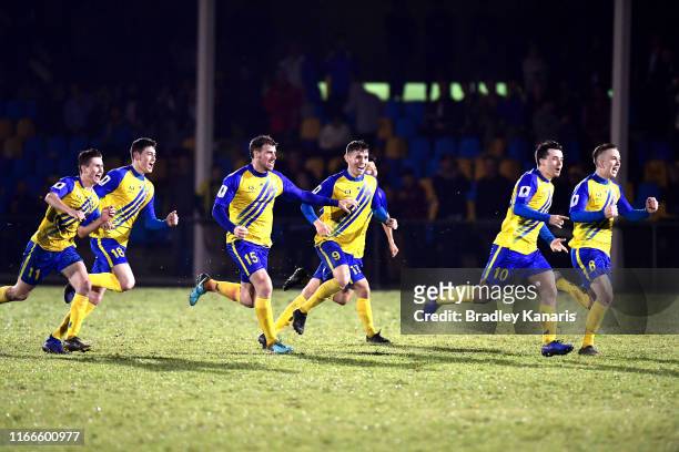 The Strikers celebrate victory during the FFA Cup Round of 32 match between the Brisbane Strikers and Wellington Phoenix at Perry Park on August 07,...