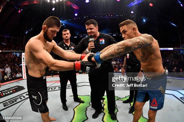 Khabib Nurmagomedov of Russia and Dustin Poirier touch gloves prior to their lightweight championship bout during UFC 242 at The Arena on September...