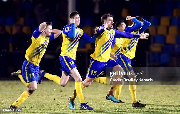 The Strikers celebrate victory during the FFA Cup Round of 32 match between the Brisbane Strikers and Wellington Phoenix at Perry Park on August 07,...