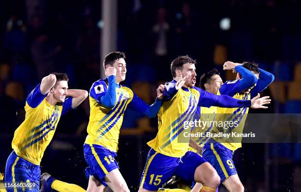 The Strikers celebrate victory during the FFA Cup Round of 32 match between the Brisbane Strikers and Wellington Phoenix at Perry Park on August 07,...