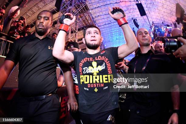 Khabib Nurmagomedov of Russia celebrates his submission victory over Dustin Poirier in their lightweight championship bout during UFC 242 at The...