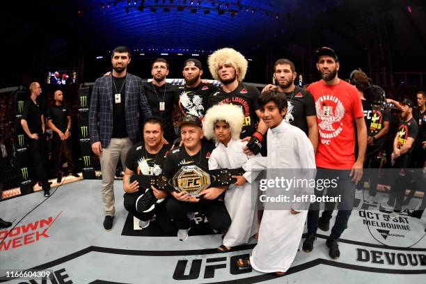 Khabib Nurmagomedov of Russia poses for a photo with his team after his submission victory over Dustin Poirier in their lightweight championship bout...