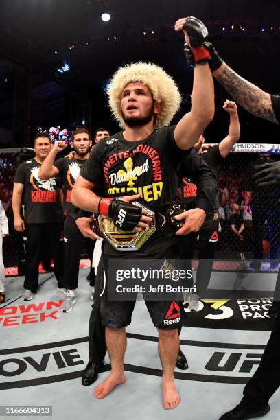 Khabib Nurmagomedov of Russia celebrates his submission victory over Dustin Poirier in their lightweight championship bout during UFC 242 at The...