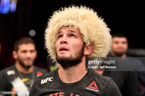 Khabib Nurmagomedov of Russia celebrates his submission victory over Dustin Poirier in their lightweight championship bout during UFC 242 at The...