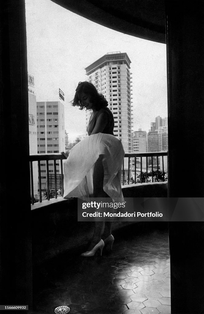 A woman with wind blown skirt