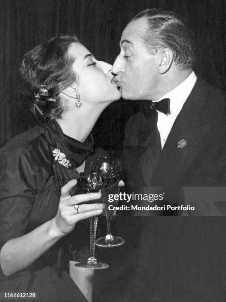 Italian actor Totò kissing Italian actress and his partner Franca Faldini. Italy, 1950s