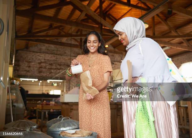 Young women buying food at plastic free market