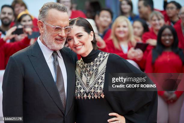 Actor Tom Hanks and Director Marielle Heller pose for photographers at the premier of 'A Beautiful Day in the Neighbourhood' at the Toronto...