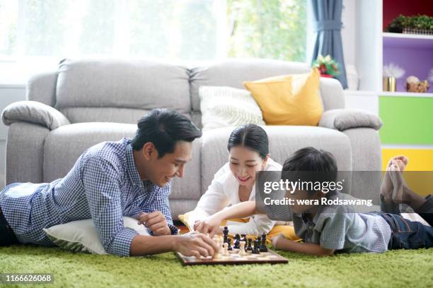 parents spending time to playing with their kid - family time stock pictures, royalty-free photos & images