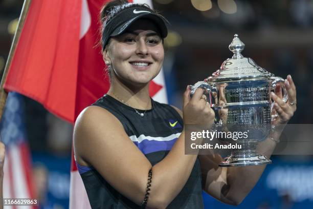 Bianca Andreescu of Canada poses with the trophy after her US Open Championships women's singles final match against Serena Williams of USA at Billie...