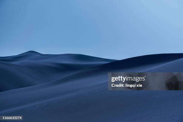 desert under the moonlit night in western china - western sahara stock-fotos und bilder