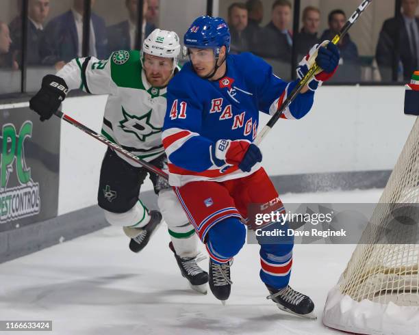 Nico Gross of the New York Rangers battles for position with Adam Mascherin of the Dallas Stars during Day-2 of the NHL Prospects Tournament at...
