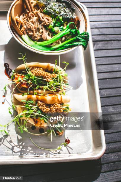 vegan steamed bao buns and ramen - healthy burger stock pictures, royalty-free photos & images
