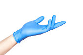 Doctor hand in blue gloves in holding position isolated on white