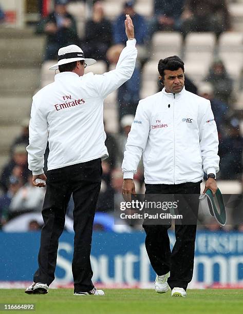 Umpire Rod Tucker and Aleem Dar takes the players off as rain falls during day two of the 3rd npower Test Match between England and Sri Lanka at the...