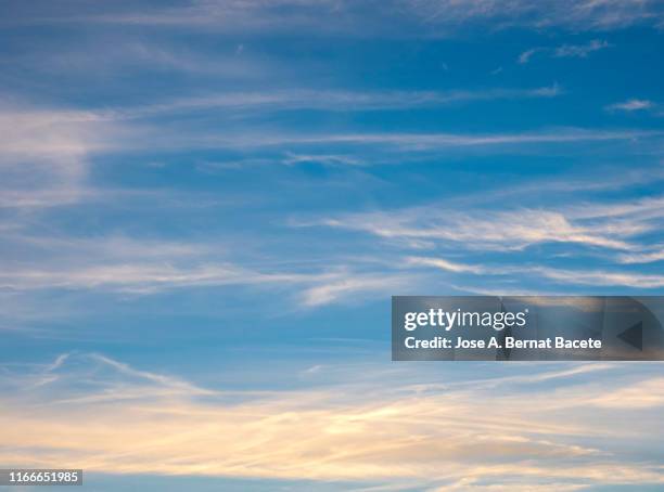 full frame of the low angle view of clouds in sky during sunset. - sunset with jet contrails stock pictures, royalty-free photos & images
