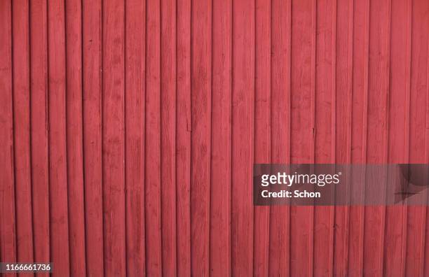 a red painted house wall in wood - schweden stock-fotos und bilder