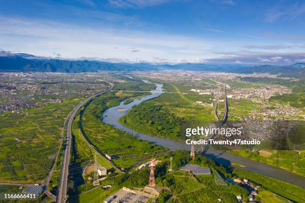 aerial view of nagano city from above, chikuma river flow through city - nagano prefecture stock pictures, royalty-free photos & images