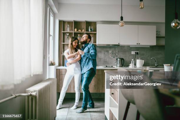 couple dancing in the kitchen - couple dancing at home stock pictures, royalty-free photos & images