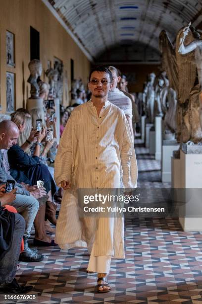 The designer Mark Kenly Domino Tan walks the runway at the end of his show during the Copenhagen Fashion Week Spring/Summer 2020 on August 07, 2019...