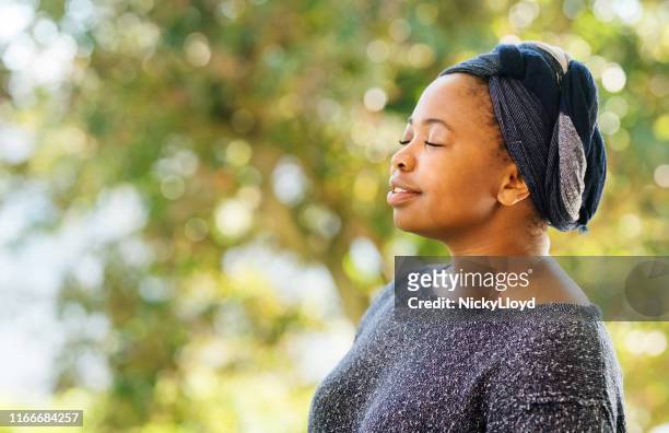 relaxing in blissful atmosphere - head tie stock pictures, royalty-free photos & images