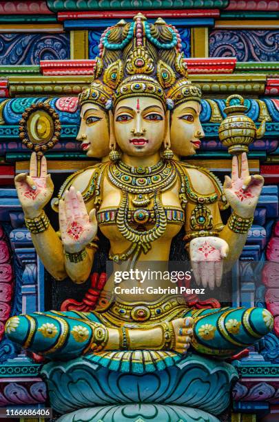 a hindu statue in bangkok, thailand - brama stock pictures, royalty-free photos & images