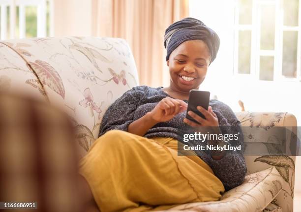 texting is her best pastime - head tie stock pictures, royalty-free photos & images