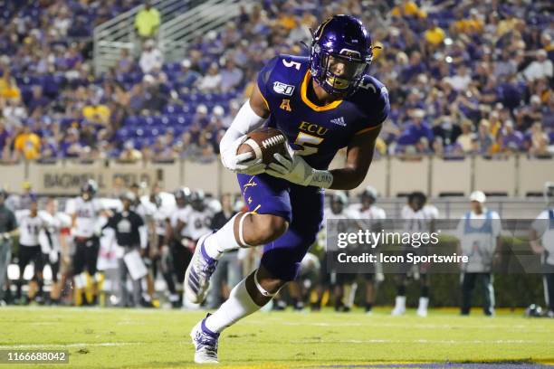 East Carolina Pirates wide receiver C.J. Johnson catches a pass during a game between the East Carolina Pirates and the Gardner-Webb Runnin' Bulldogs...