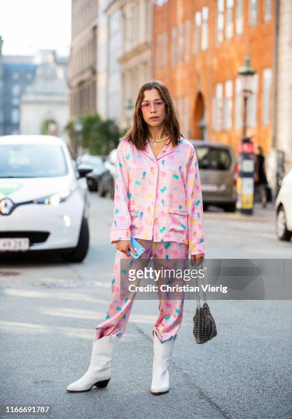 Nicole Huisman is seen wearing pink pyjama, white cowboy boots outside Helmstedt during Copenhagen Fashion Week Spring/Summer 2020 on August 07, 2019...