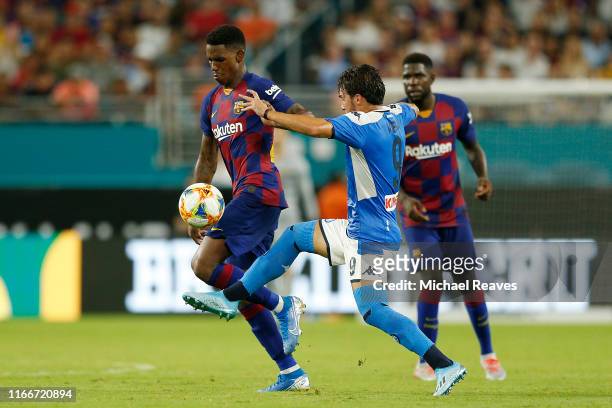Simone Verdi of SSC Napoli battles for the ball with Ousmane Dembele of FC Barcelona during the second half of a preseason friendly match at Hard...