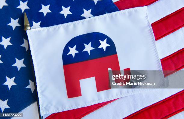 republican elephant symbol on a flag on top of the american flag. - republican party 個照片及圖片檔