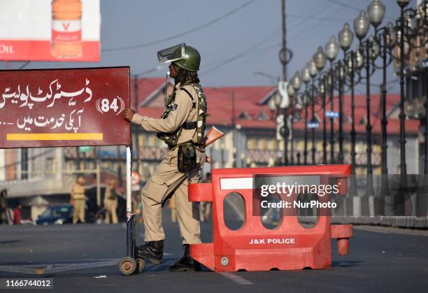 An Indian paramilitary soldier stands alert near the military check point in Srinagar,Kashmir on September 08, 2019.Government imposed strict curfew...