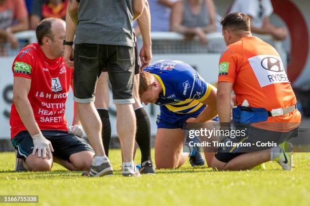 August 3: Jack Hughes of Warrington Wolves is treated on the field by medical staff after injuring a testicle, it was later revealed he carried on...