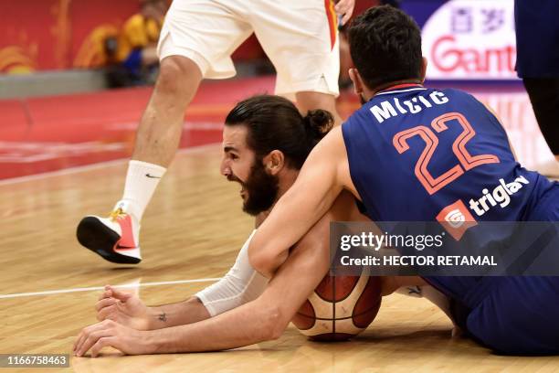 Serbia's Vasilije Micic blocks Spain's Ricky Rubio during the Basketball World Cup Group J second round game between Spain and Serbia in Wuhan on...