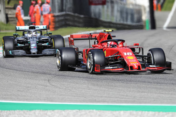 Charles Leclerc driving the (16) Scuderia Ferrari Mission Winnow and Lewis Hamilton driving the (44) Mercedes AMG Petronas Motorsport on track during the Formula One Grand Prix of Italy at Autodromo di Monza on September 8, 2019 in Monza, Italy.
