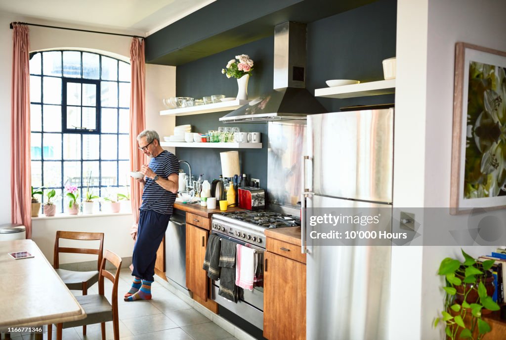 Mature man eating breakfast in the morning