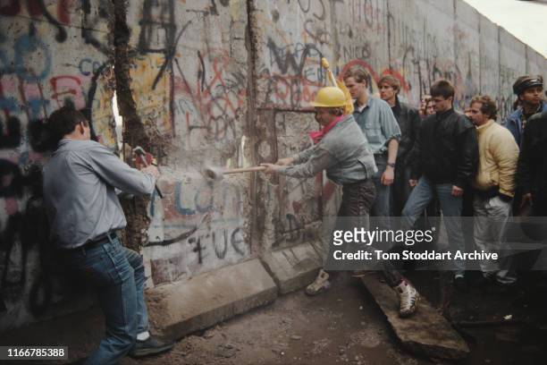 The first section of the Berlin Wall is torn down by crowds on the morning of 10th November 1989. The area around the breach was later secured by...
