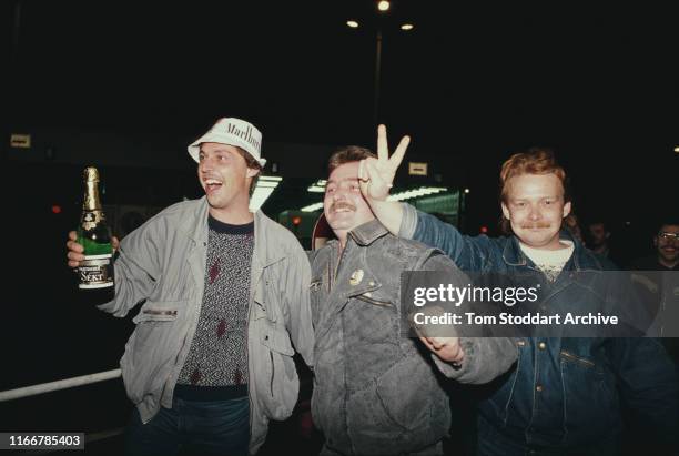 Berliners celebrate at Checkpoint Charlie on the night of 9th November 1989, when East Berliners were allowed to cross into the west for the first...