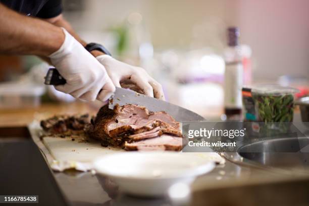 meat adding to the carbon emissions; climate change; global warming - surgical glove stock pictures, royalty-free photos & images