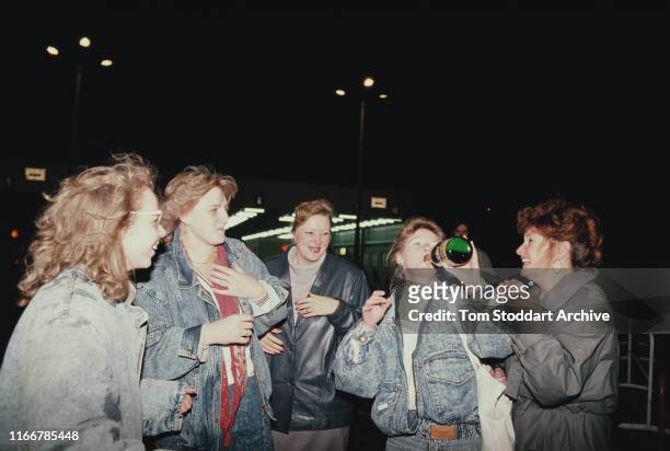 Berliners celebrate at Checkpoint Charlie on the night of 9th November 1989, when East Berliners were allowed to cross into the west for the first...
