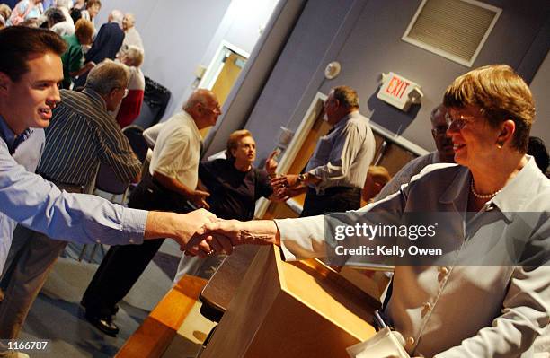 Former U.S. Attorney General Janet Reno, who is campaigning for governor of Florida, speaks to a group of Palm Beach County residents October 4, 2001...