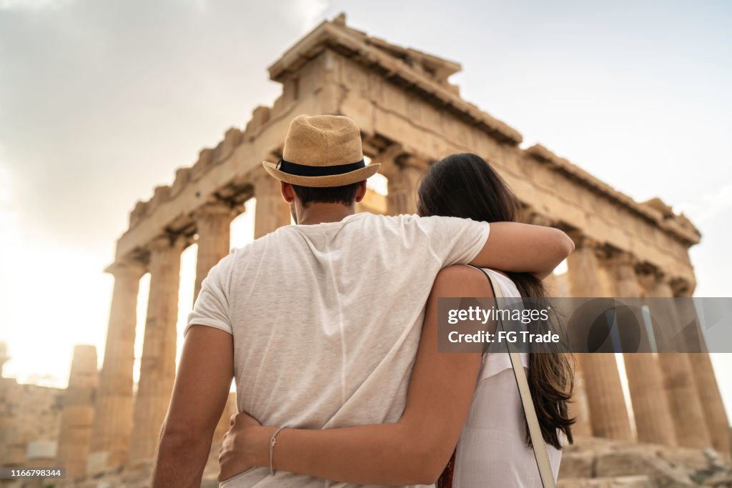 Rear View Of A Young Couple Embracing Standing In The Acropolis, Athens