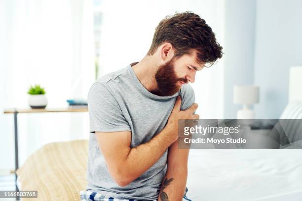 i slept on the wrong side - muscle arm stock pictures, royalty-free photos & images