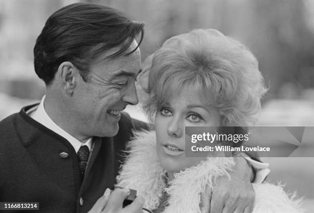 English actor, writer and producer Richard Johnson and American actress Kim Novak pictured together after their marriage, UK, 17th March 1965.