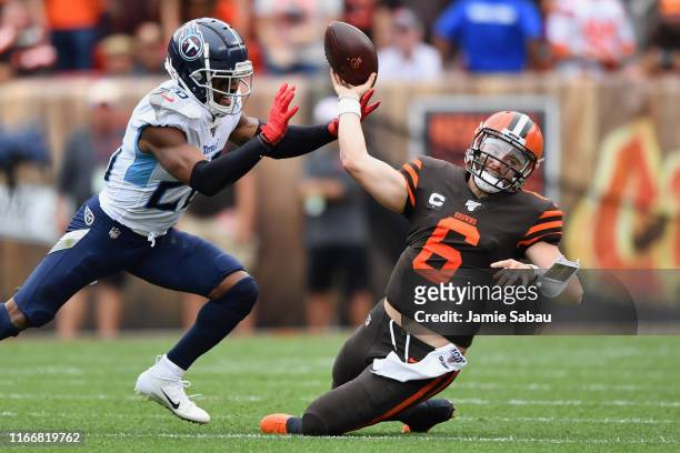 Quarterback Baker Mayfield of the Cleveland Browns is sacked by Logan Ryan of the Tennessee Titans in the second quarter at FirstEnergy Stadium on...