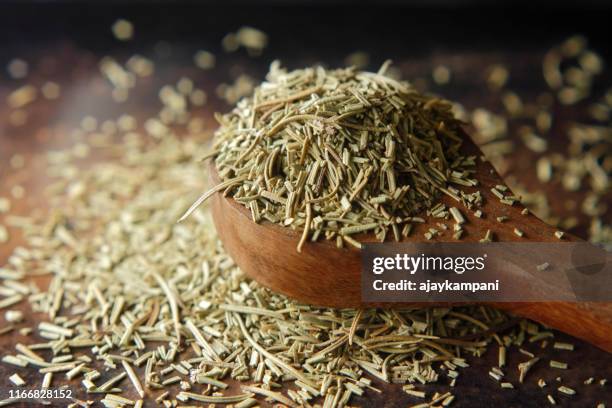 dry rosemary spice on dark. macro with shallow depth of field. - rosemary stock pictures, royalty-free photos & images